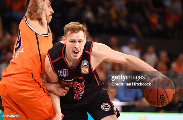 Rhys Vague of the Wildcats drives to the basket during the round three NBL match between the Cairns Taipans and the Perth Wildcats at Cairns...