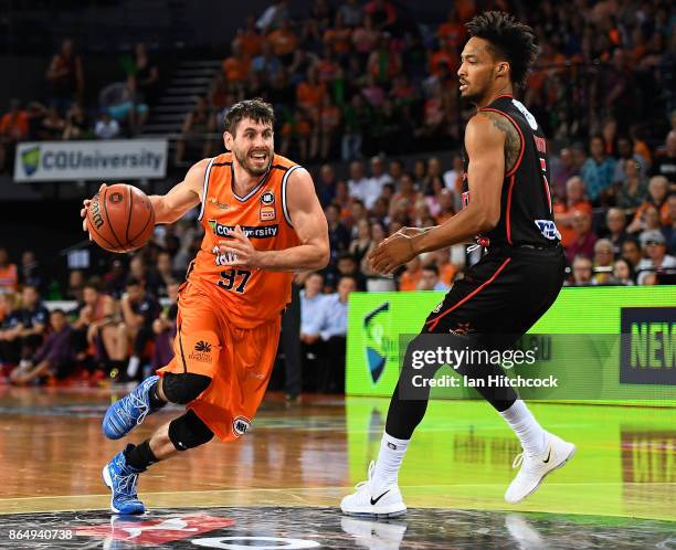 Jarrad Weeks of the Taipans drives to the basket during the round three NBL match between the Cairns Taipans and the Perth Wildcats at Cairns...