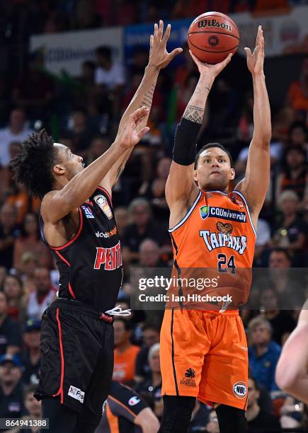 Michael Carrera of the Taipans take a shot during the round three NBL match between the Cairns Taipans and the Perth Wildcats at Cairns Convention...