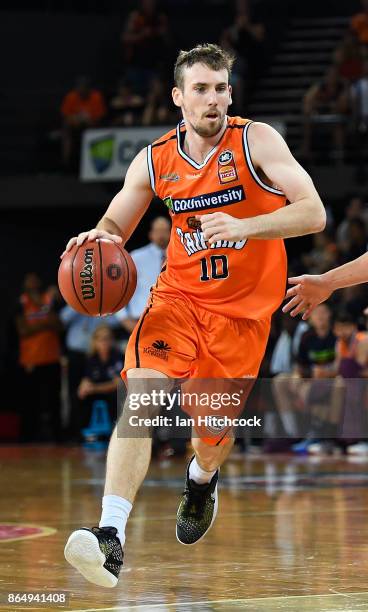 Mitch McCarron of the Taipans drives to the basket during the round three NBL match between the Cairns Taipans and the Perth Wildcats at Cairns...