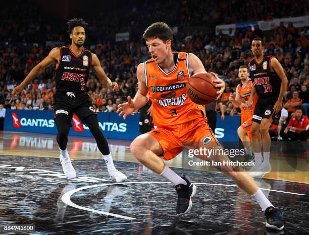 Cam Gliddon of the Taipans gathers a rebound during the round three NBL match between the Cairns Taipans and the Perth Wildcats at Cairns Convention...