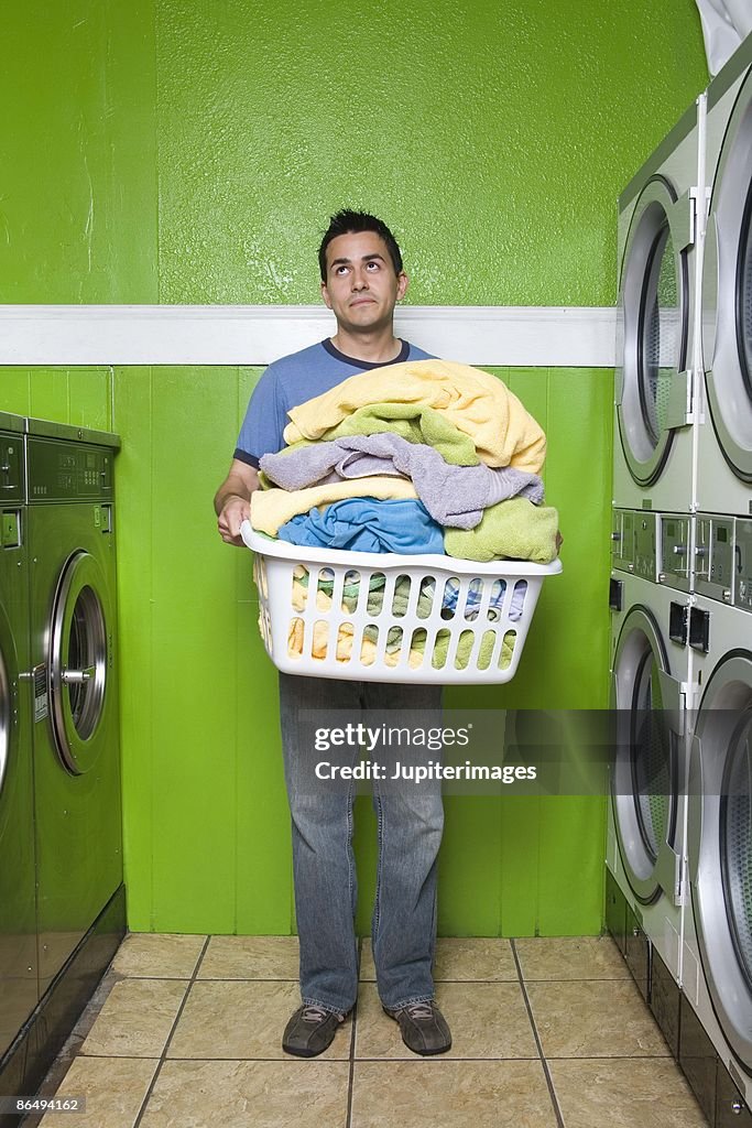 Man carrying laundry basket