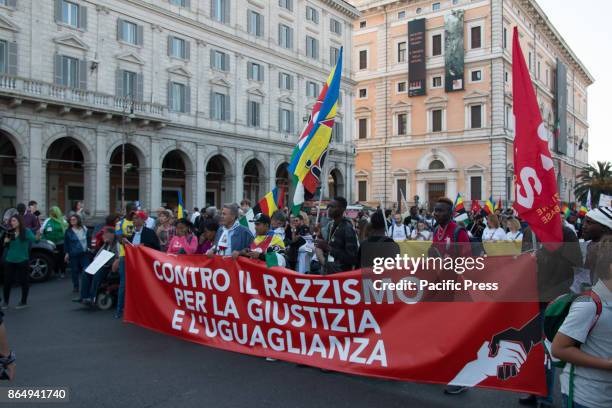 Demonstrators hold an anti-racism protest in the streets of Rome.