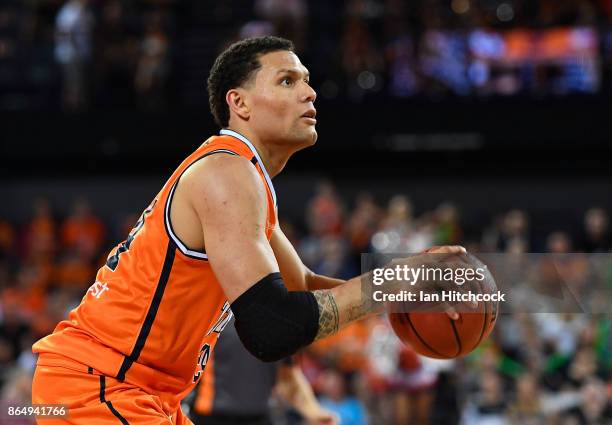 Michael Carrera of the Taipans looks to make a shot during the round three NBL match between the Cairns Taipans and the Perth Wildcats at Cairns...