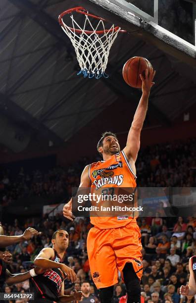 Jarrad Weeks of the Taipans attempts a layup during the round three NBL match between the Cairns Taipans and the Perth Wildcats at Cairns Convention...