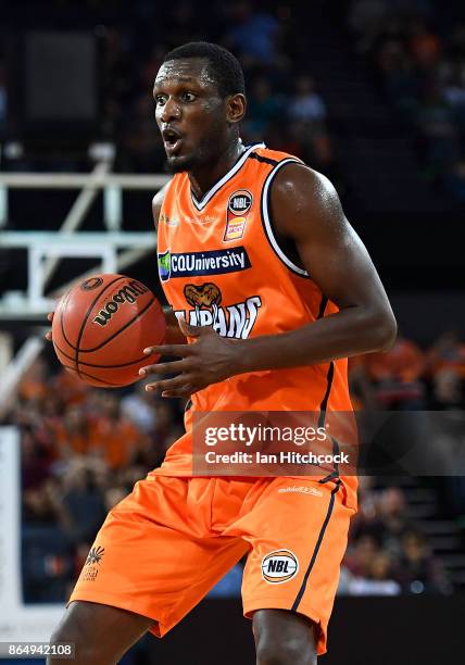 Nnanna Egwu of the Taipans dribbles the ball during the round three NBL match between the Cairns Taipans and the Perth Wildcats at Cairns Convention...