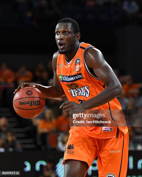 Nnanna Egwu of the Taipans dribbles the ball during the round three NBL match between the Cairns Taipans and the Perth Wildcats at Cairns Convention...