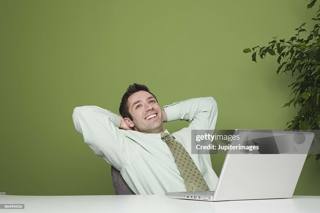 Relaxed Computer User Businessman Relaxing By Laptop High-Res Stock Photo - Getty Images