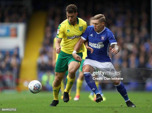 Martyn Waghorn of Ipswich and Yanic Wildschut of Norwich City battle for possession during the Sky Bet Championship match between Ipswich Town and...