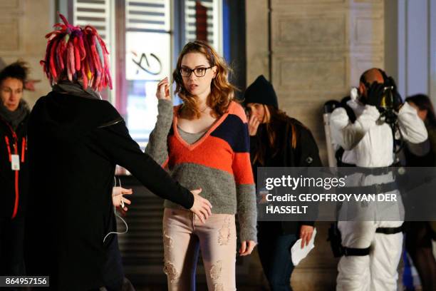 Director Lana Wachowski talks with US actress Jamie Clayton on the set of Netflix TV sci-fi series "Sense8" in the Montmartre area of Paris on...