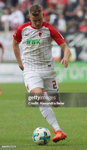 Alfred Finnbogason of FC Augsburg kicks the ball during the Bundesliga match between FC Augsburg and Hannover 96 at WWK-Arena on October 21, 2017 in...