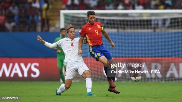 Abel Ruiz of Spain is challenged by Amir Esmaeil Zadeh of Iran during the FIFA U-17 World Cup India 2017 Quarter Final match between Spain and Iran...