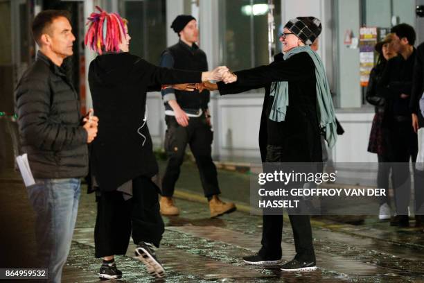 Director Lana Wachowski dances with her girlfriend Karin Winslow on the set of Netflix TV sci-fi series "Sense8" in the Montmartre area of Paris on...