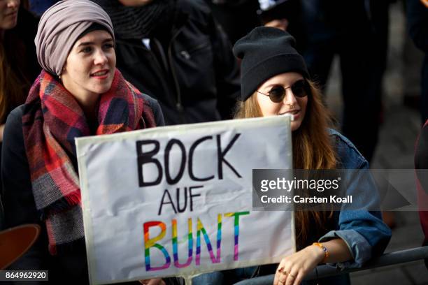 Demonstrators protesting against racism in front of the Brandenburger Tor near the Reichstag, seat of the Bundestag, on October 22, 2017 in Berlin,...
