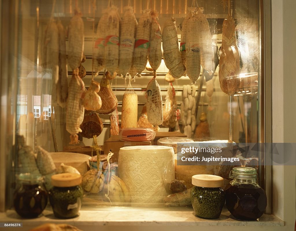 Deli window display with meats and cheeses