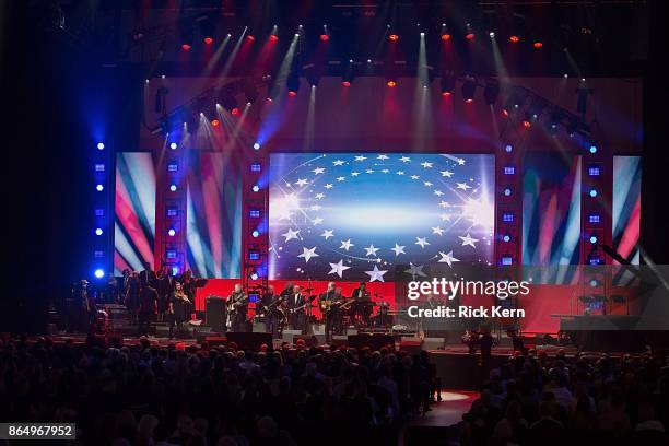 Larry Gatlin, Steve Gatlin, and Rudy Gatlin of The Gatlins perform onstage during the 'Deep from the Heart: The One America Appeal Concert' at Reed...
