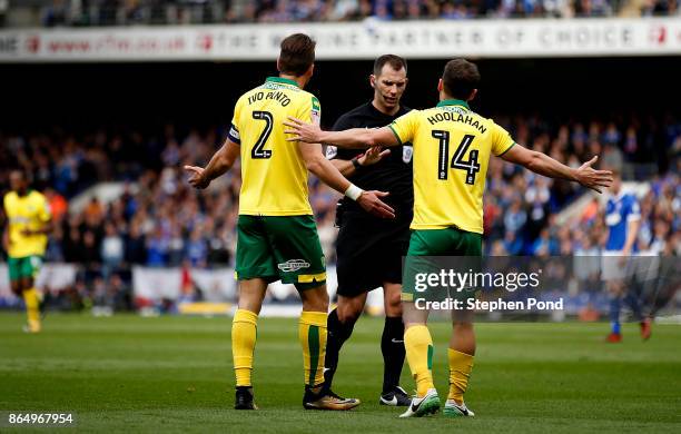 Wes Hoolahan and Ivo Pinto of Norwich City contest a decision by referee Tim Robinson during the Sky Bet Championship match between Ipswich Town and...