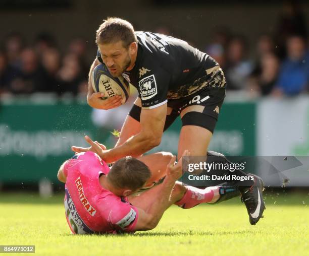 Francois Steyn of Montpellier is tackled by Gareth Steenson during the European Rugby Champions Cup match between Montpellier and Exeter Chiefs at...