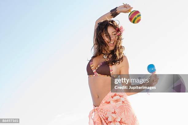 woman dancing with maracas - maracas bildbanksfoton och bilder