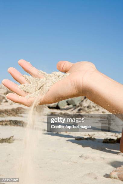 Sifting Example Sifting Sand Through Hands Photos and Premium High Res Pictures - Getty ...