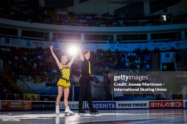 Evgenia Tarasova and Vladimir Morozov of Russia pose in the Pairs medal ceremony during day three of the ISU Grand Prix of Figure Skating, Rostelecom...