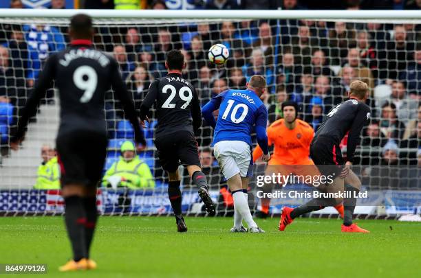 Wayne Rooney of Everton scores the opening goal during the Premier League match between Everton and Arsenal at Goodison Park on October 22, 2017 in...