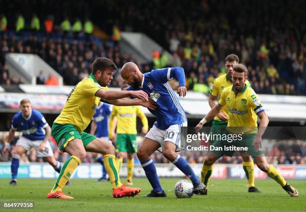 David McGoldrick of Ipswich and Grant Hanley of Norwich City battle for possession during the Sky Bet Championship match between Ipswich Town and...