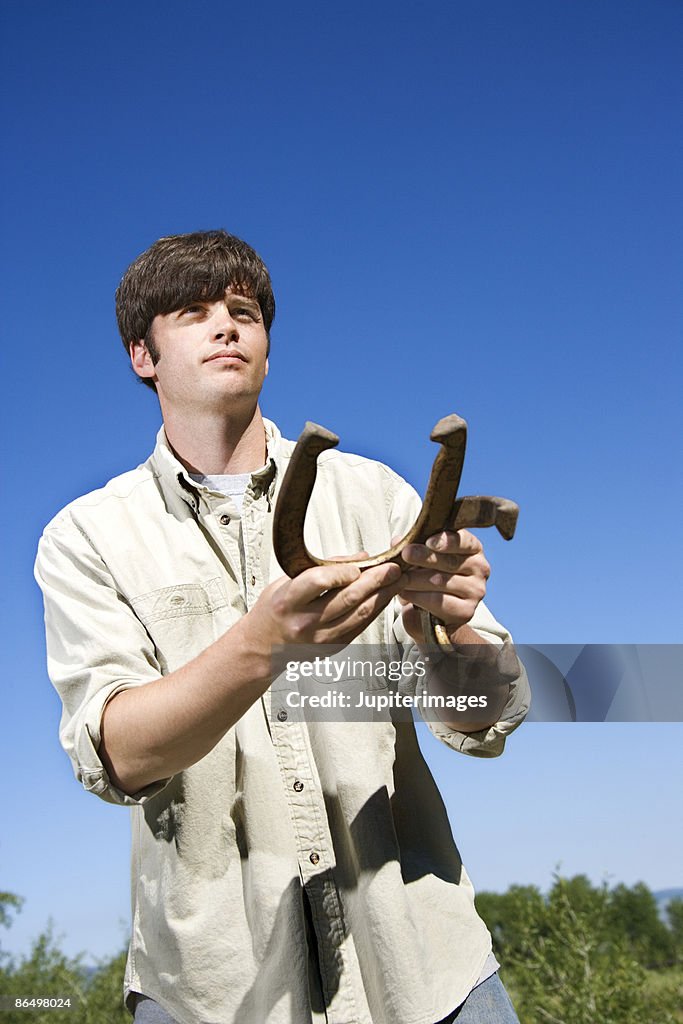 Man playing horseshoes