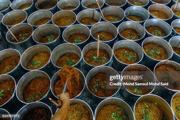 Chinese devotees prepair free foods during The Nine Emperor Gods Festival inside the temple on October 22, 2017 in Kuala Lumpur, Malaysia. The Nine...