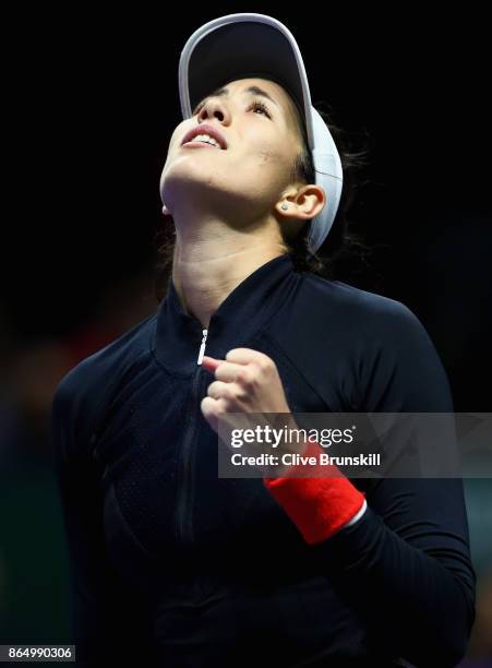 Garbine Muguruza of Spain celebrates victory in her singles match against Jelena Ostapenko of Latvia during day 1 of the BNP Paribas WTA Finals...