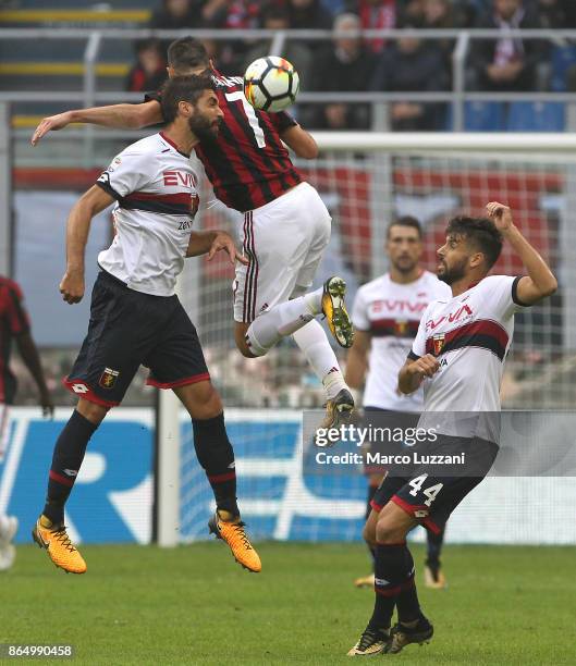 Nikola Kalinic of AC Milan competes for the ball with Luca Rossettini and Miguel Veloso of Genoa CFC during the Serie A match between AC Milan and...