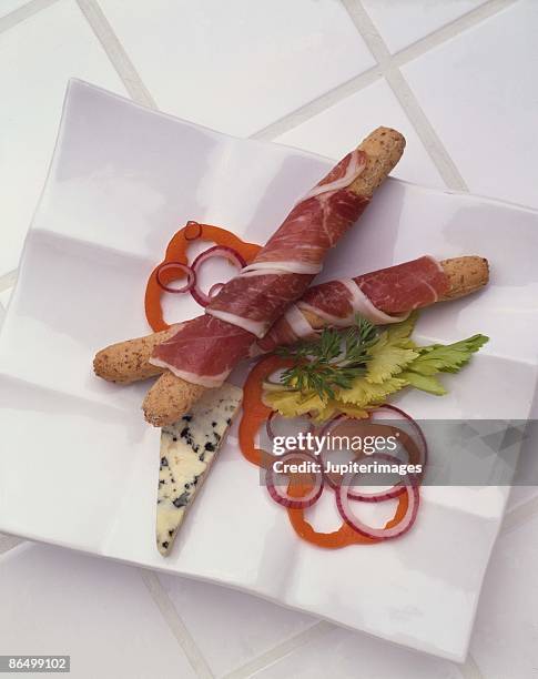 breadsticks wrapped with prosciutto - prosciutto wrapped stock pictures, royalty-free photos & images