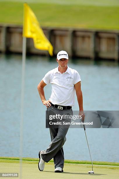 John Mallinger waits on the 18th green during the first round of THE PLAYERS Championship on THE PLAYERS Stadium Course at TPC Sawgrass on May 7,...