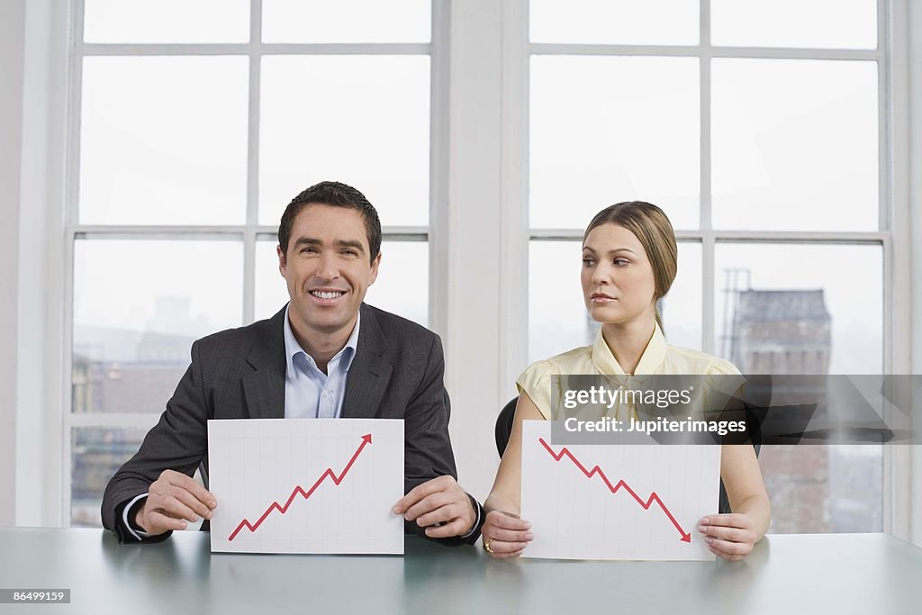 Businesspeople with graphs