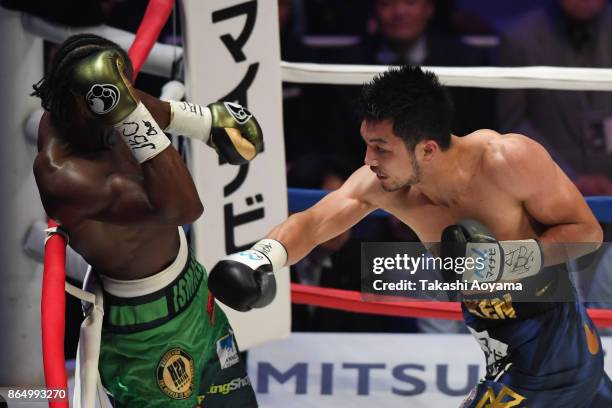 Ryota Murata of Japan punches Hassan N'Dam N'Jikam of France during their WBA Middleweight Title Bout at Ryogoku Kokugikan on October 22, 2017 in...
