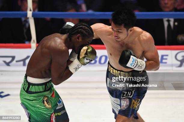 Ryota Murata of Japan punches Hassan N'Dam N'Jikam of France during their WBA Middleweight Title Bout at Ryogoku Kokugikan on October 22, 2017 in...