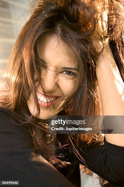 woman ruffling hair - ruffling stock pictures, royalty-free photos & images