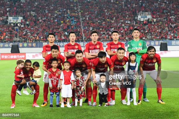 Players of Guangzhou Evergrande line up before the 2017 Chinese Football Association Super League 28th round match between Guangzhou Evergrande...