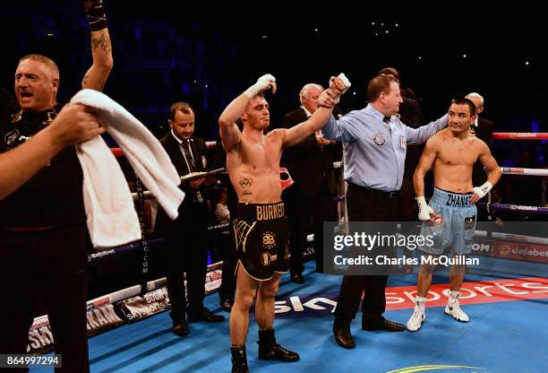 Ryan Burnett of Northern Ireland is declared the winner after his bout with Zhanat Zhakiyanov of Kazakhstan for the IBF, WBO and IBO World...