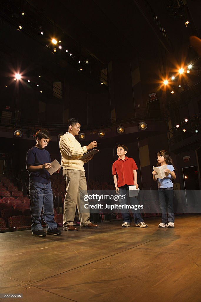 Student Play Example Man And Students Practicing A Play High-Res Stock Photo - Getty Images