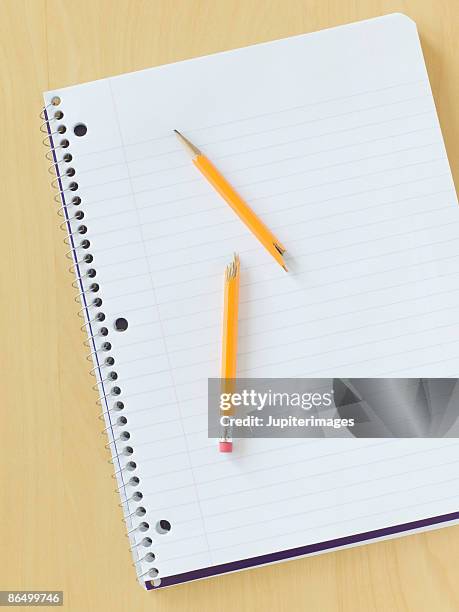 notebook with broken pencil - snapped pencil stock pictures, royalty-free photos & images
