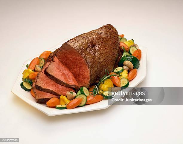 roast beef with vegetables - roasted stock pictures, royalty-free photos & images