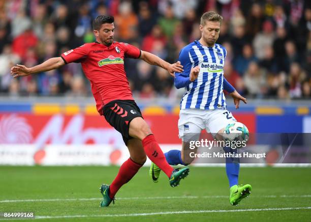 Marco Terrazzino of Freiburg and Mitchell Weiser of Berlin compete for the ball during the Bundesliga match between Sport-Club Freiburg and Hertha...