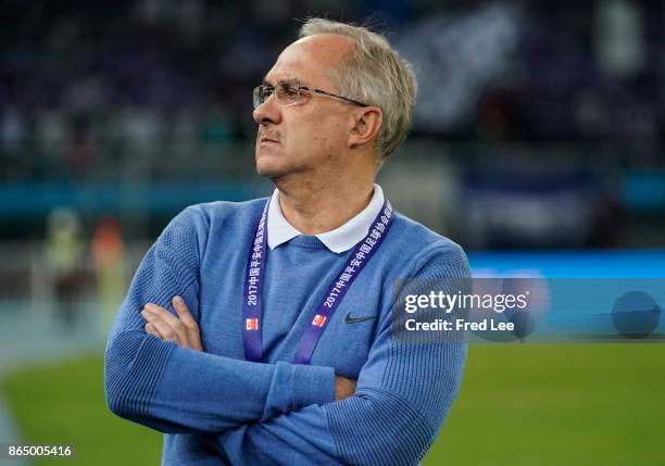 Head coach of Tianjin Elion FC Uli Stielike reacts during the Chinese Super League match between Tianjin Elion FC and Beijing Guoan FC at Tianjin...