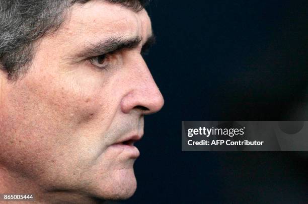 Spanish Juande Ramos, the new head coach of Tottenham Hotspur football club attends a Premiership football match against Wigan at the Tottenham...