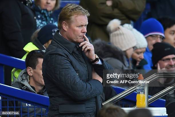 Everton's Dutch manager Ronald Koeman looks on after Arsenal score their fourth goal during the English Premier League football match between Everton...