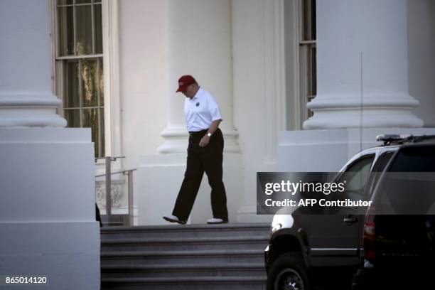 President Donald Trump walks from the White House to his motorcade before traveling to his Trump National Golf Club on October 22, 2017 in...