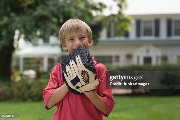 portrait of boy with baseball glove - baseball glove stock pictures, royalty-free photos & images