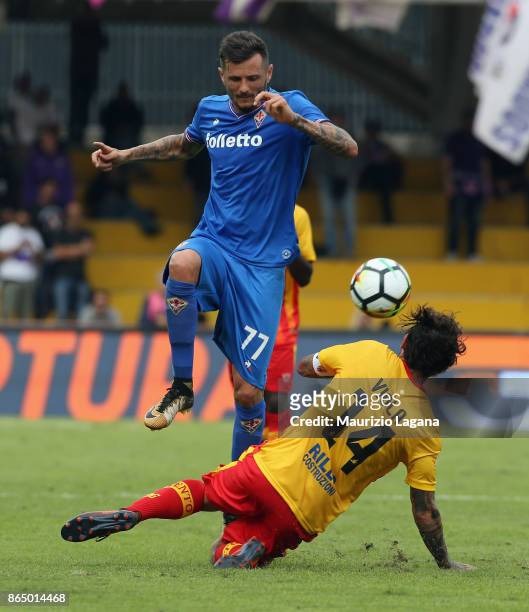 Nicoals Viola of Benevento competes for the ball with Cyril Thereau of Fiorentina during the Serie A match between Benevento Calcio and ACF...