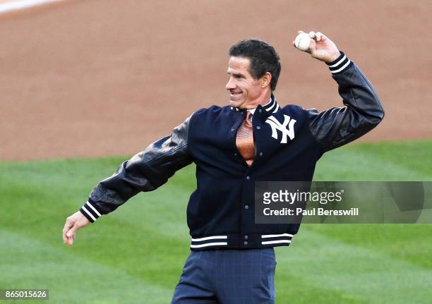 Former Yankee player Paul O'Neill throws out the ceremonial first pitch before Game Four of the American League Championship Series against the...